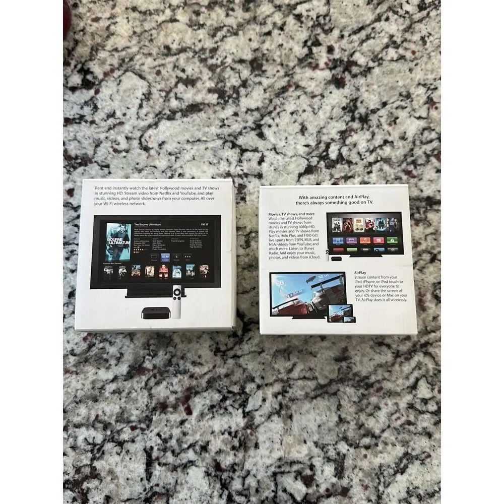2 empty Apple TV boxes no Apple TV included